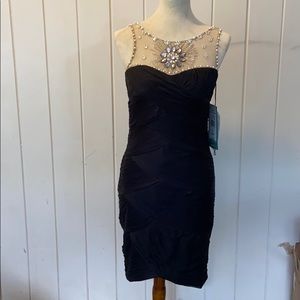 Scarlett Nite thigh-length, fit dress.